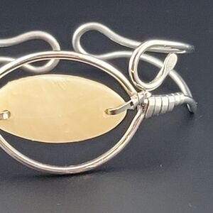Handmade silver bracelet with carved shell